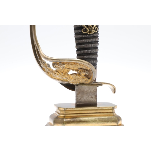 117 - A SWORD HILT DESK ORNAMENT FORMED FROM A PRUSSIAN INFANTRY OFFICER'S 1889 PATTERN SWORD. A sword hil... 