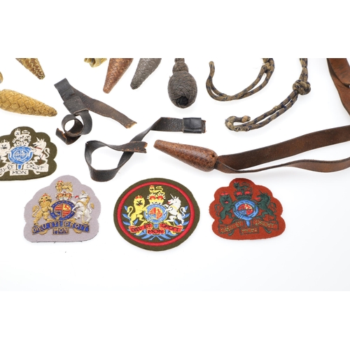 121 - A COLLECTION OF SWORD KNOTS AND MILITARY BADGES. A collection of nine sword knots, various patterns ... 