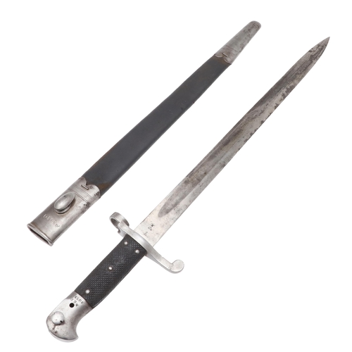 128 - A VICTORIAN MARTINI HENRY 1887 PATTERN BAYONET AND SCABBARD. With a 46 cm pointed single edged blade... 