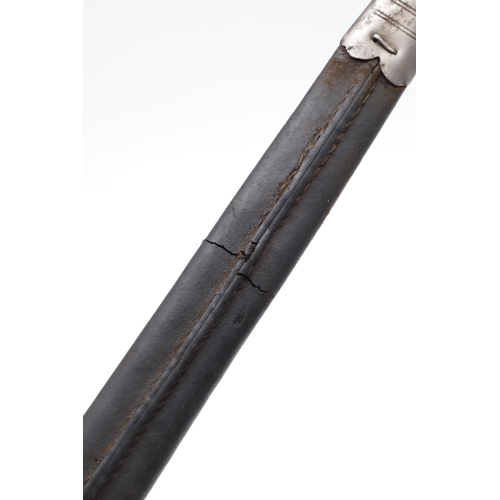 128 - A VICTORIAN MARTINI HENRY 1887 PATTERN BAYONET AND SCABBARD. With a 46 cm pointed single edged blade... 