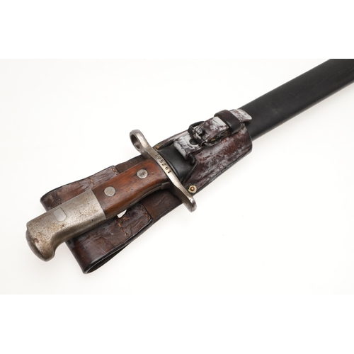 133 - A SWISS 1889 PATTERN SAWBACK BAYONET AND SCABBARD. With a 48 cm blade with a sharpened edge and saw ... 