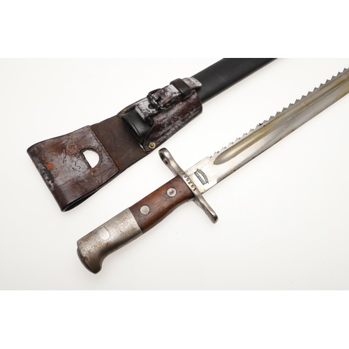 133 - A SWISS 1889 PATTERN SAWBACK BAYONET AND SCABBARD. With a 48 cm blade with a sharpened edge and saw ... 