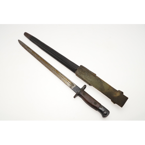 137 - A 1907 PATTERN BAYONET AND SCABBARD AND ANOTHER SIMILAR. A 1907 pattern bayonet with a 43 cm, single... 