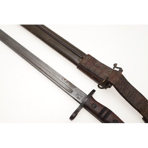 152 - AN AMERICAN REMINGTON FIRST WORLD WAR 1917 PATTERN BAYONET AND SCABBARD. A 1917 pattern bayonet with... 