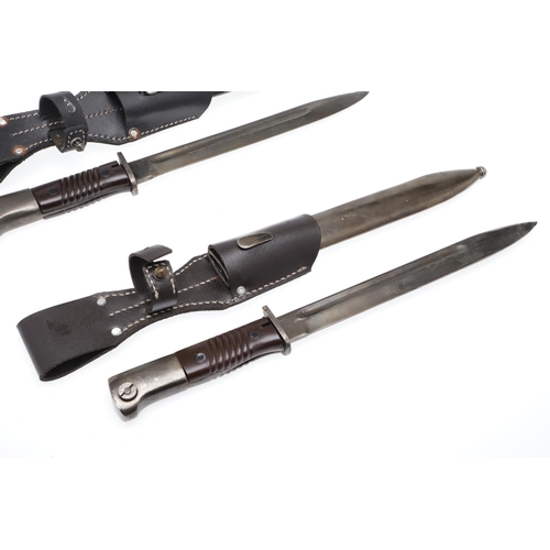 155 - TWO SECOND WORLD WAR GERMAN K98 MAUSER BAYONET AND SCABBARDS. Each with a 25 cm pointed single edged... 