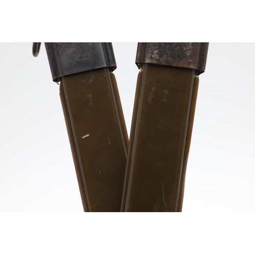 156 - TWO AMERICAN 1943 PATTERN M1 BAYONETS AND SCABBARDS. Each with 24.5 cm pointed, single edged blades ... 