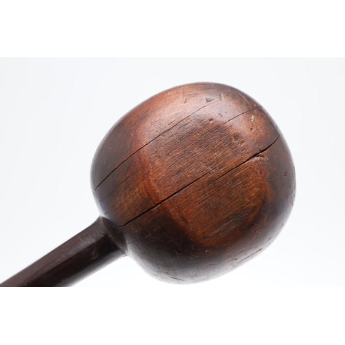 157 - AN ANTIQUE ZULU KNOBKERRIE. A large hardwood knobkerrie with round head on a long shaft. 65 cm long,... 