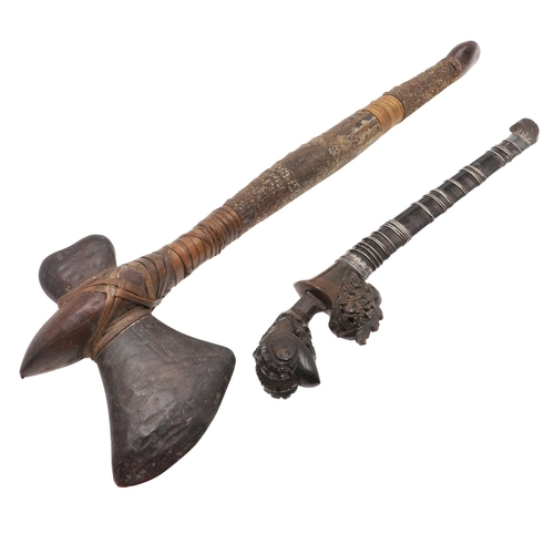 170 - A MALAYAN KRIS WITH CARVED HANDLE AND MOUNTED SCABBARD. ALSO AN AXE. A Malayan Kris with a 24.5 cm s... 