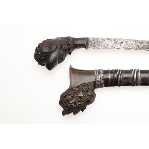 170 - A MALAYAN KRIS WITH CARVED HANDLE AND MOUNTED SCABBARD. ALSO AN AXE. A Malayan Kris with a 24.5 cm s... 