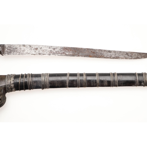 170 - A MALAYAN KRIS WITH CARVED HANDLE AND MOUNTED SCABBARD. ALSO AN AXE. A Malayan Kris with a 24.5 cm s... 