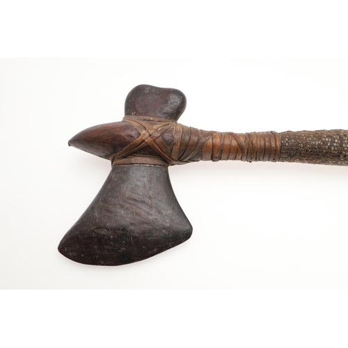 170 - A MALAYAN KRIS WITH CARVED HANDLE AND MOUNTED SCABBARD. ALSO AN AXE. A Malayan Kris with a 24.5 cm s... 