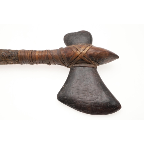 170 - A MALAYAN KRIS WITH CARVED HANDLE AND MOUNTED SCABBARD. ALSO AN AXE. A Malayan Kris with a 24.5 cm s... 