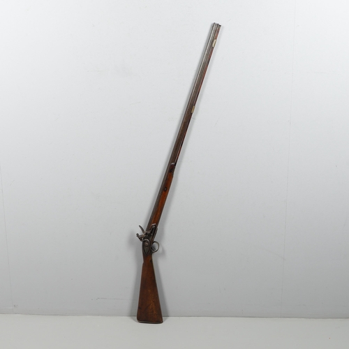 19 - A LATE 18TH CENTURY FLINTLOCK GUN BY MORRIS. With a 94cm tapering barrel with proof marks and decora... 