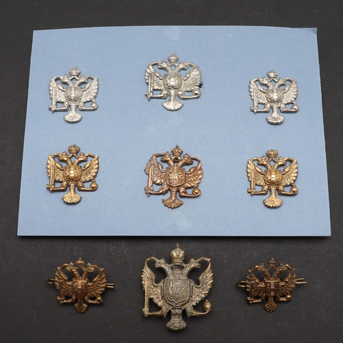 193 - AN INTERESTING COLLECTION OF 1ST KING'S DRAGOON GUARDS CAP AND COLLAR BADGES. A collection of 1st Ki... 