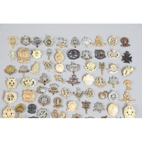 209 - A COLLECTION OF APPROXIMATELY 100 CAP BADGES TO INCLUDE SOUTH LANCASHIRE AND OTHERS. A collection of... 