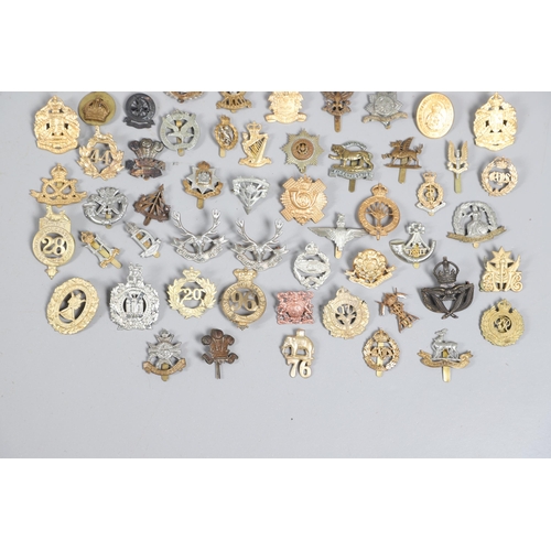 209 - A COLLECTION OF APPROXIMATELY 100 CAP BADGES TO INCLUDE SOUTH LANCASHIRE AND OTHERS. A collection of... 