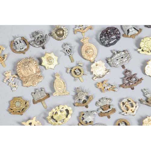 209 - A COLLECTION OF APPROXIMATELY 100 CAP BADGES TO INCLUDE SOUTH LANCASHIRE AND OTHERS. A collection of... 