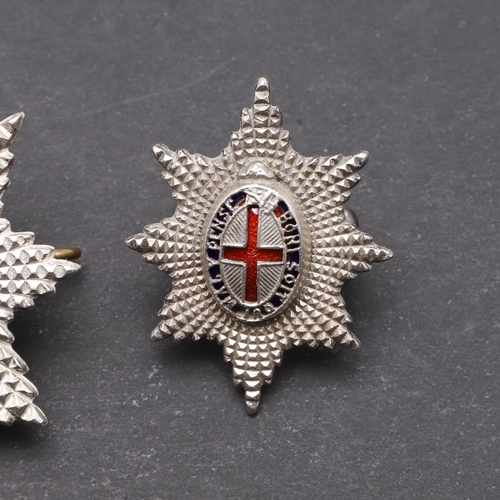 221 - A COLDSTREAM GUARD'S OFFICERS SILVER AND ENAMEL CAP BADGE AND ANOTHER. A Coldstream Guard's officers... 