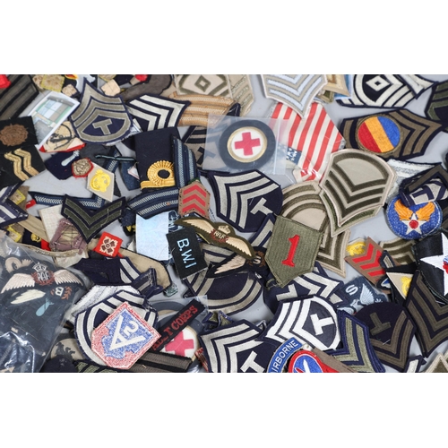 224 - AN EXTENSIVE COLLECTION OF ARMY AND AIR FORCE UNIFORM PATCHES AND RANK INSIGNIA. An extensive collec... 