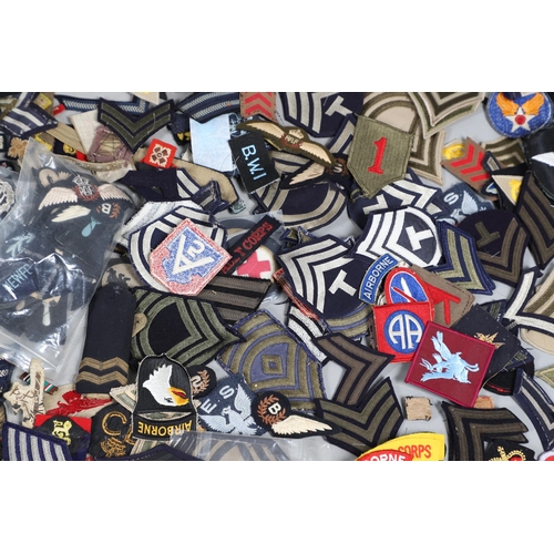 224 - AN EXTENSIVE COLLECTION OF ARMY AND AIR FORCE UNIFORM PATCHES AND RANK INSIGNIA. An extensive collec... 