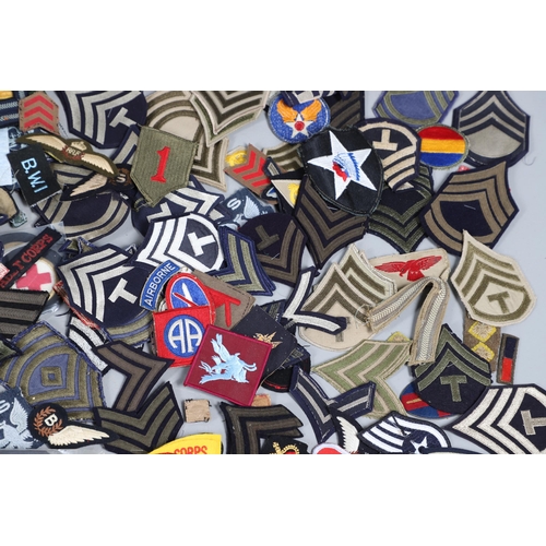 224 - AN EXTENSIVE COLLECTION OF ARMY AND AIR FORCE UNIFORM PATCHES AND RANK INSIGNIA. An extensive collec... 