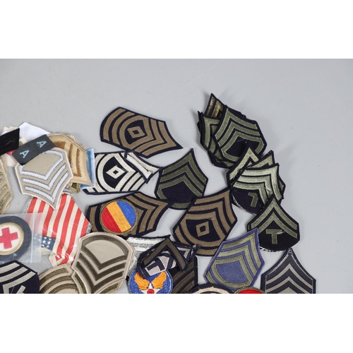 224 - AN EXTENSIVE COLLECTION OF ARMY AND AIR FORCE UNIFORM PATCHES AND RANK INSIGNIA. An extensive collec... 