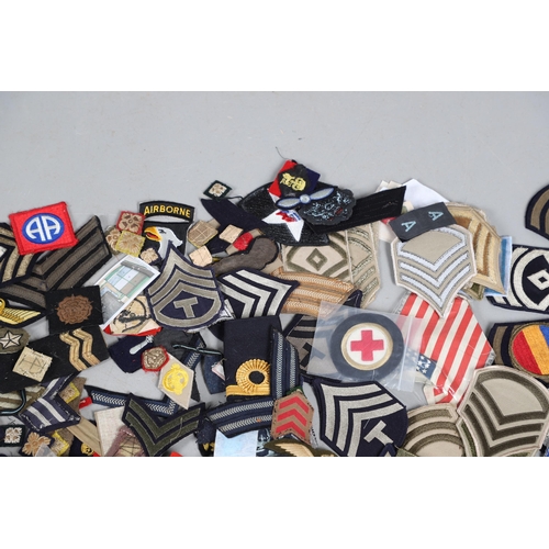 224 - AN EXTENSIVE COLLECTION OF ARMY AND AIR FORCE UNIFORM PATCHES AND RANK INSIGNIA. An extensive collec... 