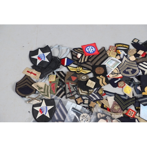 224 - AN EXTENSIVE COLLECTION OF ARMY AND AIR FORCE UNIFORM PATCHES AND RANK INSIGNIA. An extensive collec... 