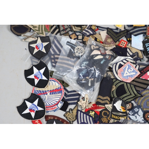 224 - AN EXTENSIVE COLLECTION OF ARMY AND AIR FORCE UNIFORM PATCHES AND RANK INSIGNIA. An extensive collec... 