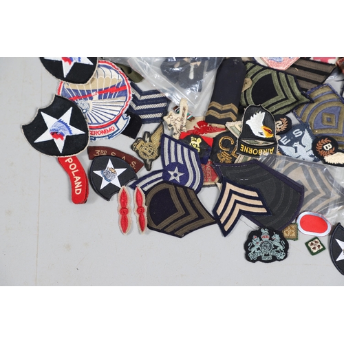 224 - AN EXTENSIVE COLLECTION OF ARMY AND AIR FORCE UNIFORM PATCHES AND RANK INSIGNIA. An extensive collec... 