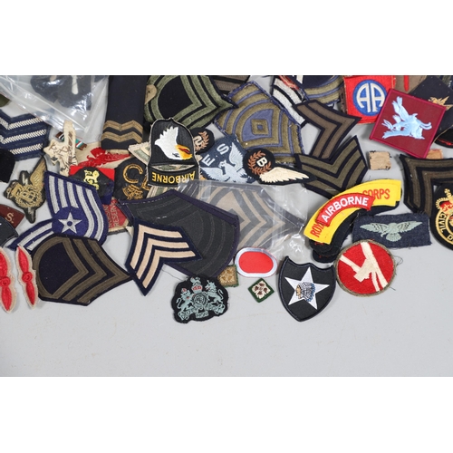 224 - AN EXTENSIVE COLLECTION OF ARMY AND AIR FORCE UNIFORM PATCHES AND RANK INSIGNIA. An extensive collec... 