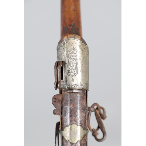 26 - A 19TH CENTURY MATCHLOCK LONG GUN. With a 119 cm barrel tapering from octagonal to round with decora... 