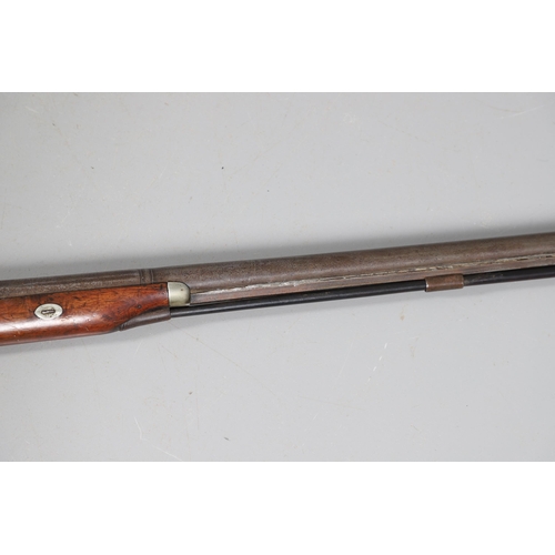 27 - A 19TH CENTURY PERCUSSION SPORTING GUN. With a 79 cm barrel tapering from octagonal to round, marked... 