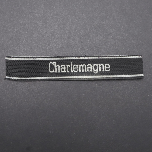 341 - A SECOND WORLD WAR WAFFEN-SS 'CHARLEMAGNE' CUFFBAND. A Waffen-SS 'Charlemagne' cuffband. Bevo type m... 