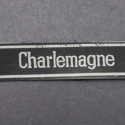 341 - A SECOND WORLD WAR WAFFEN-SS 'CHARLEMAGNE' CUFFBAND. A Waffen-SS 'Charlemagne' cuffband. Bevo type m... 