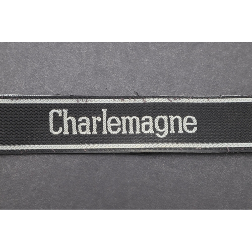 341 - A SECOND WORLD WAR WAFFEN-SS 'CHARLEMAGNE' CUFFBAND. A Waffen-SS 'Charlemagne' cuffband. Bevo type m... 