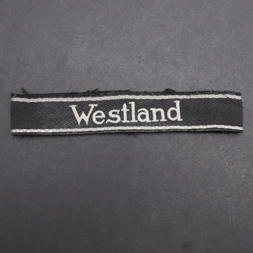 342 - A SECOND WORLD WAR WAFFEN-SS 'WESTLAND' CUFFBAND. A Waffen-SS 'Westland' cuffband. RZM type machine ... 