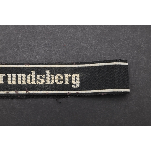 352 - A SECOND WORLD WAR WAFFEN-SS 'FRUNDSBERG' CUFFBAND. A Waffen-SS 'Frundsberg' cuffband. Machine woven... 