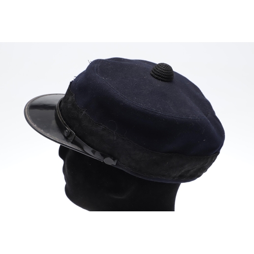 355 - A MILITARY STYLE FORAGE CAP, WHISTLE AND OTHER ITEMS. A Military style forage cap in dark blue/black... 