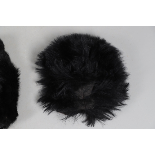 408 - A UNIFORM BEARSKIN COVER AND A SIMILAR MUFF. A unifrom bearskin cover and a similar muff.