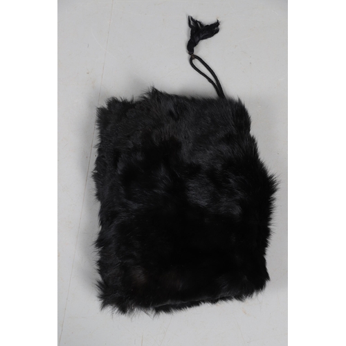 408 - A UNIFORM BEARSKIN COVER AND A SIMILAR MUFF. A unifrom bearskin cover and a similar muff.