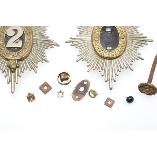 418 - A 2ND (QUEEN'S BAYS) DRAGOON GUARD HELMET PLATE AND OTHER HELMET FITTINGS. A 'Bays' helmet plate wit... 