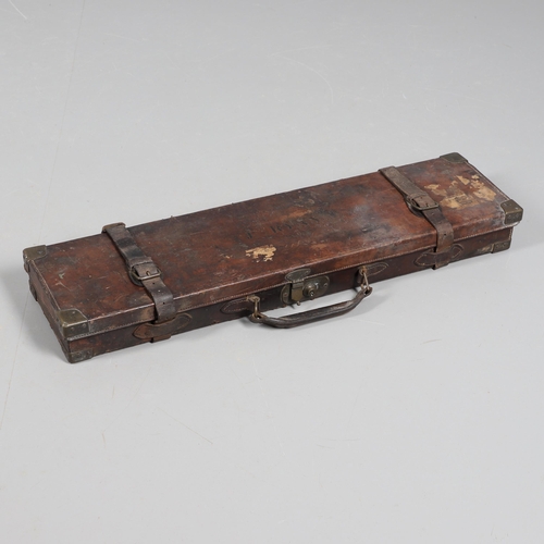 42 - A LEATHER GUN CASE WITH LABEL FOR WILLIAM POWELL AND SONS. A leather gun case, the interior fitted f... 