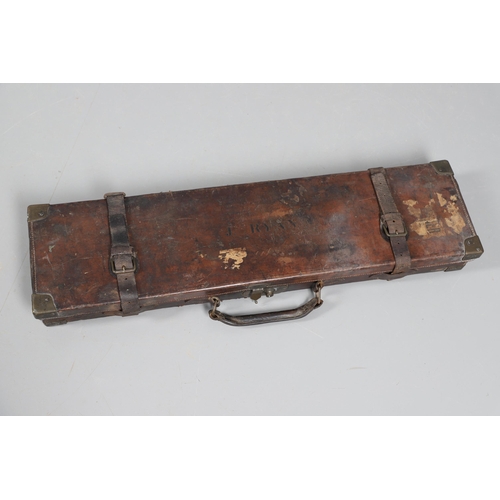 42 - A LEATHER GUN CASE WITH LABEL FOR WILLIAM POWELL AND SONS. A leather gun case, the interior fitted f... 