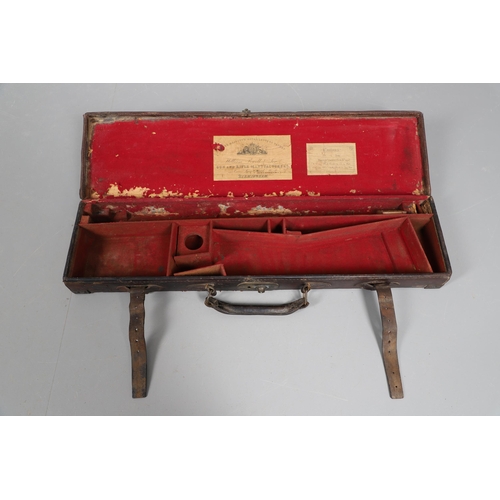 42 - A LEATHER GUN CASE WITH LABEL FOR WILLIAM POWELL AND SONS. A leather gun case, the interior fitted f... 