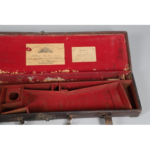 42 - A LEATHER GUN CASE WITH LABEL FOR WILLIAM POWELL AND SONS. A leather gun case, the interior fitted f... 