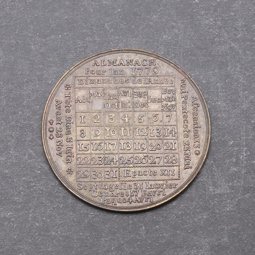 459 - A LOUIS XV CALENDAR MEDAL FOR 1779. A French brass calendar medal for the year 1779. 3.8cm.