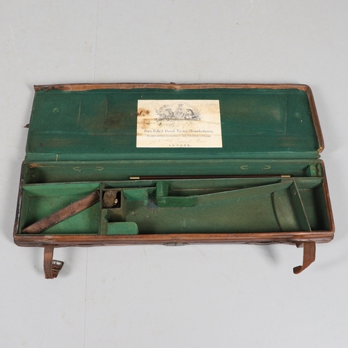 46 - A LEATHER TRAVELLING CASE FOR A SHOTGUN. A leather gun case with label for Boss & Co, London. Case 8... 