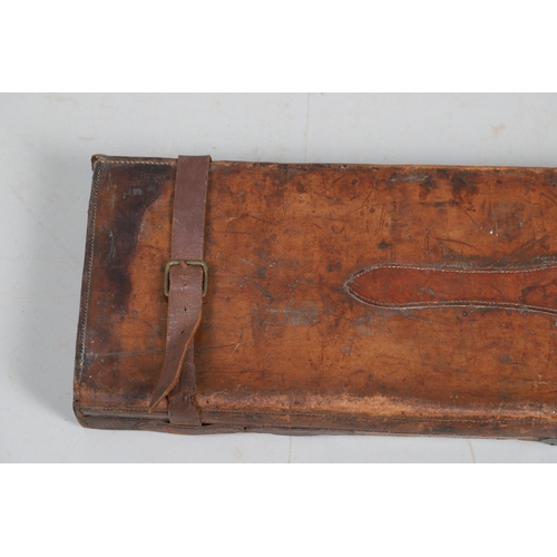 46 - A LEATHER TRAVELLING CASE FOR A SHOTGUN. A leather gun case with label for Boss & Co, London. Case 8... 