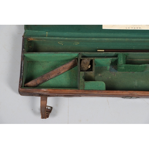 46 - A LEATHER TRAVELLING CASE FOR A SHOTGUN. A leather gun case with label for Boss & Co, London. Case 8... 